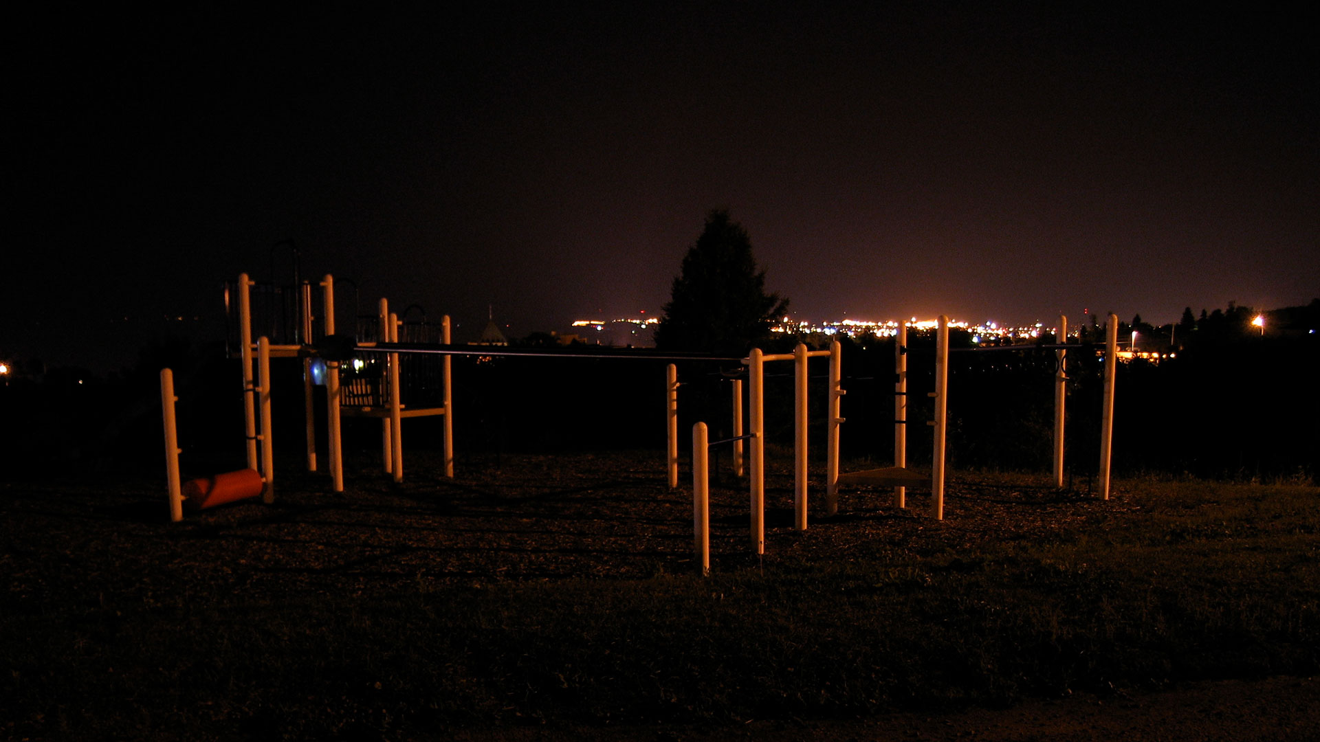 A playground at night, spooky